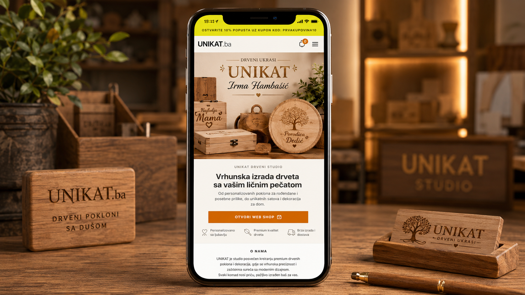 UNIKAT mobile online shop displayed on an iPhone in a warm wooden gift studio